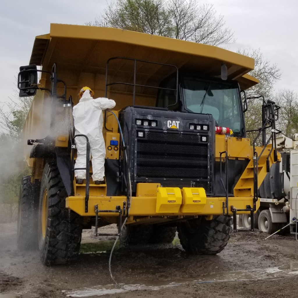 Steam cleaning heavy equipment