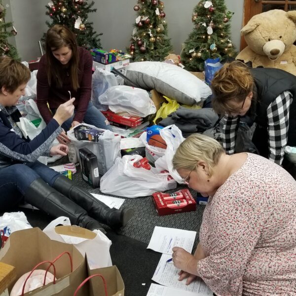 Our employees work to wrap presents from the 2018 gift drive for Bashor Children's Home